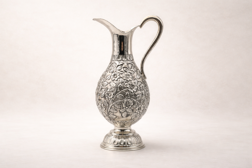 Silver-plated pitcher with hand-engraved floral artisan detailing, handcrafted in Istanbul's Grand Bazaar