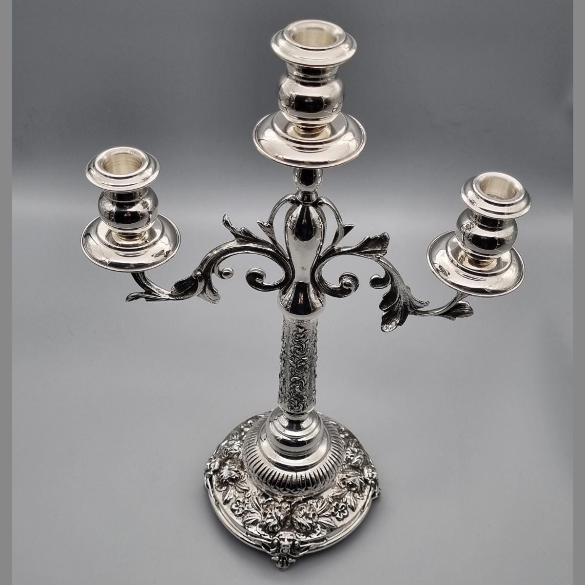 Silver-plated brass triple-arm candelabra with ornate floral relief base, hand-finished in Istanbul
