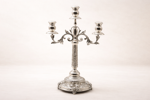 Silver-plated brass triple-arm candelabra with ornate floral relief base, hand-finished in Istanbul