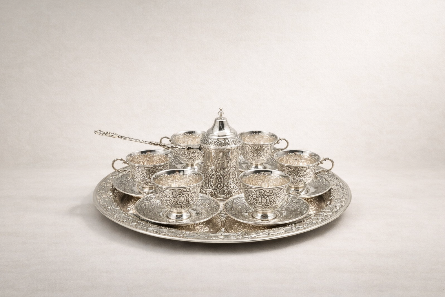 Solid 925 sterling silver Turkish coffee service for six with hand-engraved floral and scroll motifs, handcrafted in Istanbul's Grand Bazaar