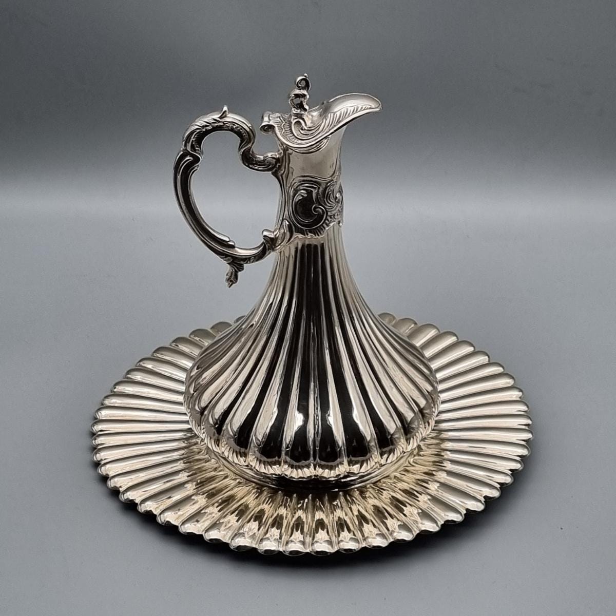 Solid silver ewer with rhythmic vertical fluting and wide scalloped tray, handcrafted in Istanbul's Grand Bazaar