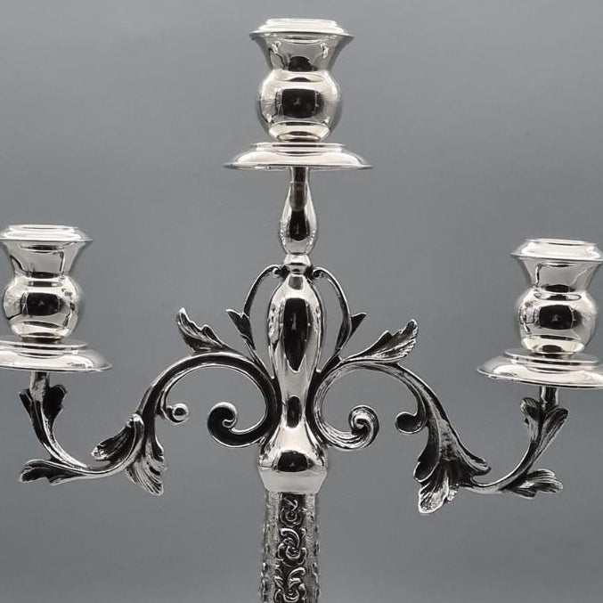 Silver-plated brass triple-arm candelabra with ornate floral relief base, hand-finished in Istanbul