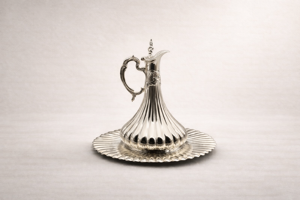 Solid silver ewer with rhythmic vertical fluting and wide scalloped tray, handcrafted in Istanbul's Grand Bazaar