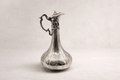 Solid 925 sterling silver ceremonial ewer with hand-engraved Ottoman floral panels, handcrafted in Istanbul's Grand Bazaar