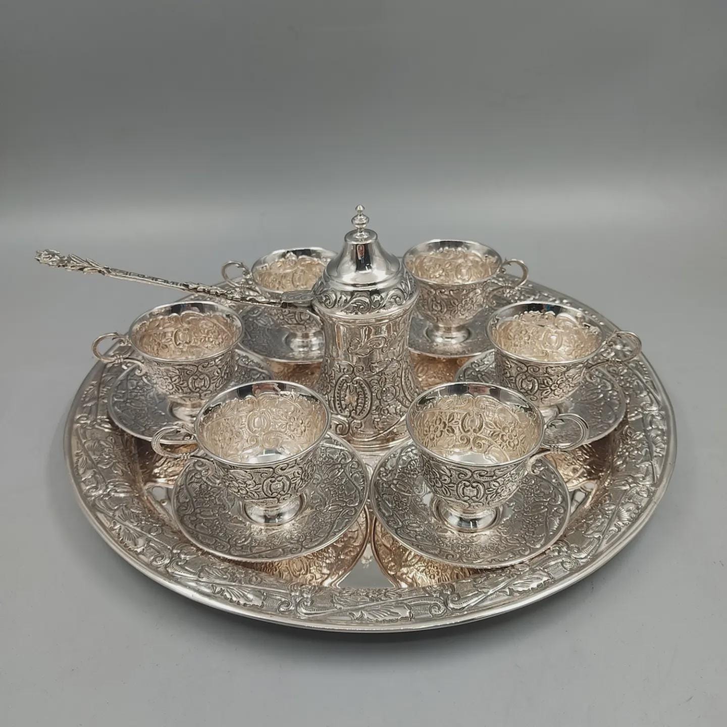 Solid 925 sterling silver Turkish coffee service for six with hand-engraved floral and scroll motifs, handcrafted in Istanbul's Grand Bazaar