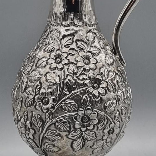 Silver-plated pitcher with hand-engraved floral artisan detailing, handcrafted in Istanbul's Grand Bazaar